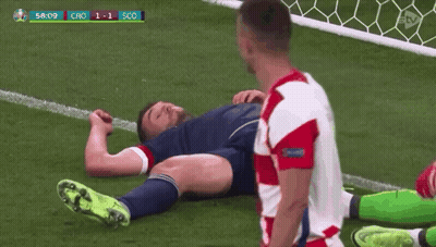 Soccer Player Laying On Ground Other Standing GIF