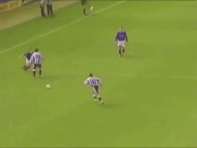 Soccer Player Laying On Ground Referee Helping GIF
