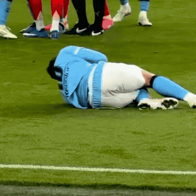Soccer Player Lying On Ground GIF