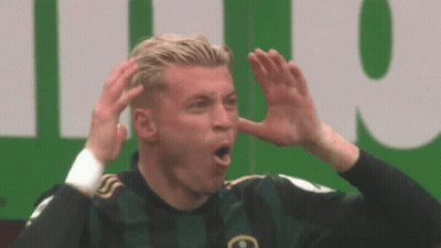 Soccer Player Making Funny Face In Green Jersey GIF