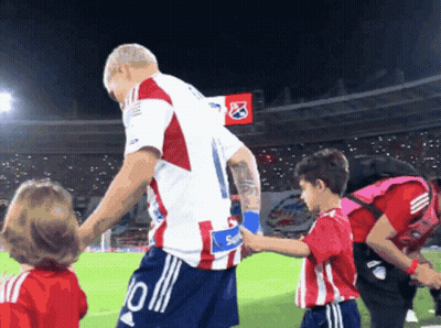 Soccer Player Number 10 Shaking Hands With Boy GIF