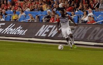 Soccer Player Number 12 Kicking Ball GIF
