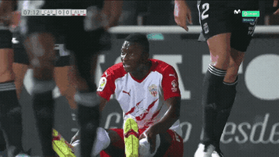 Soccer Player Number 12 Kneeling Down GIF