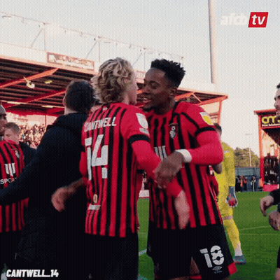 Soccer Player Number 14 Hugging Teammate GIF