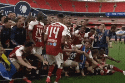 Soccer Player Number 14 Surrounded By Teammates GIF