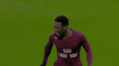 Soccer Player Number 18 Hugged By Teammates GIF