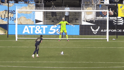 Soccer Player Number 20 Kicks Ball GIF