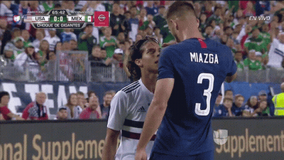 Soccer Player Number 3 Standing Next To Player GIF