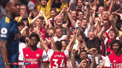 Soccer Player Number 34 Surrounded By Fans GIF