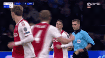 Soccer Player Number 4 In Front Of Referee GIF