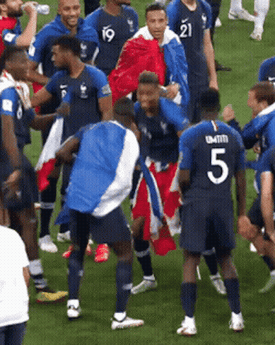 Soccer Player Number 5 Surrounded By Players GIF
