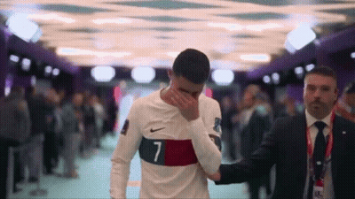 Soccer Player Number 7 Helped By Man In Suit GIF