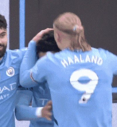 Soccer Player Number 9 Hugging Another Player GIF