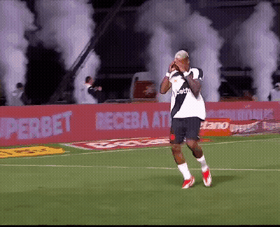 Soccer Player On Field With Smoke In Stands GIF