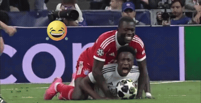 Soccer Player on Ground Opponent Tries to Get Ball