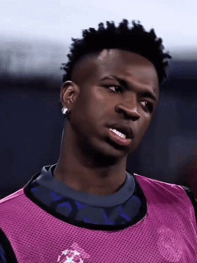 Soccer Player Purple Vest And Earrings Looking Sideways GIF
