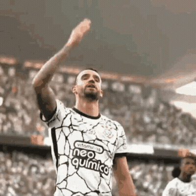 Soccer Player Raising Hand In Neo Química Jersey GIF