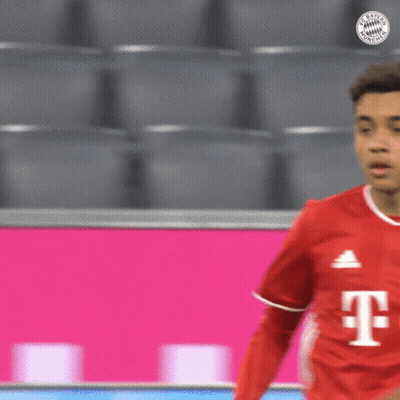 Soccer Player Red Shirt With T Looking At Another GIF