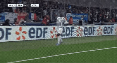 Soccer Player Running In Front Of EDF Sign GIF
