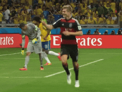 Soccer Player Running On Field In Front Of Emirates Sign GIF