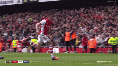 Soccer Player Running On Field With Crowd GIF