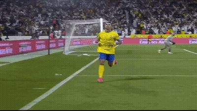 Soccer Player Running On Field With Emirates Ads GIF