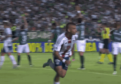 Soccer Player Running Past Everton Banner GIF