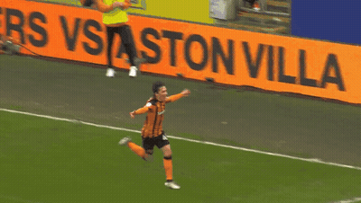 Soccer Player Running Past Ston Villa Sign GIF