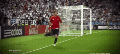 Soccer Player Running Toward Goal With Coca Cola Ad GIF