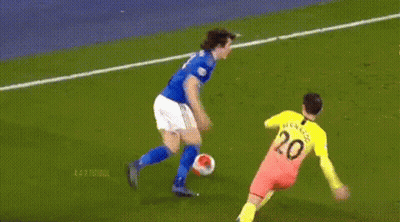 Soccer Player Running With Ball Goalie Behind GIF