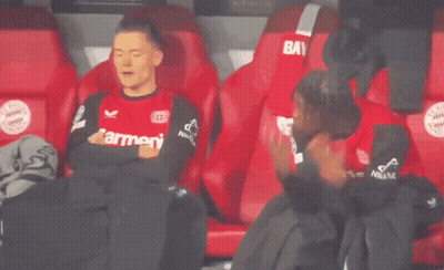 Soccer Player Sitting In Stands Red Shirt GIF