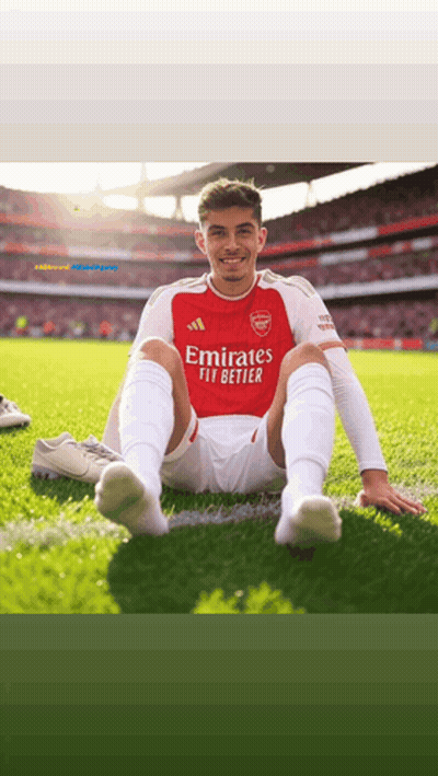 Soccer Player Sitting On Grass In Red Jersey GIF