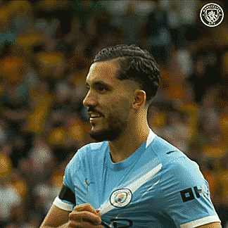 Soccer Player Smiling In Blue City Logo Shirt GIF