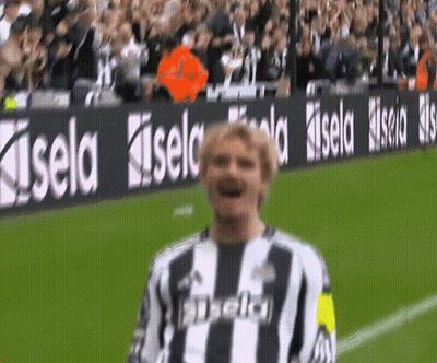 Soccer Player Standing In Front Of Kisel Sign GIF