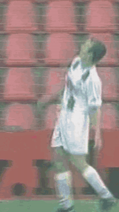 Soccer Player Standing In Front Of Red Seats GIF