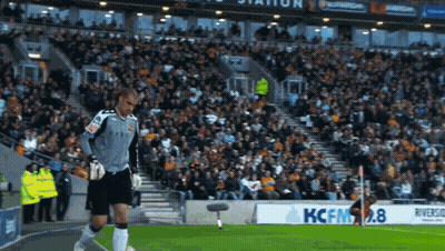 Soccer Player Standing Next To Kcfm2.8 Sign GIF