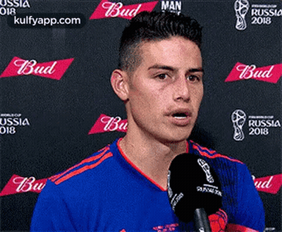 Soccer Player Talking Into Microphone At Budweiser Banner GIF