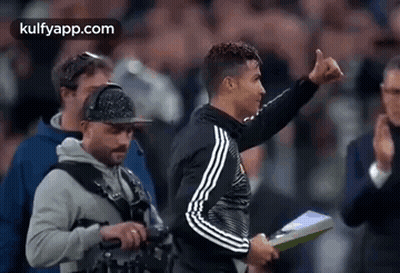 Soccer Player Thumbs Up Holding Clipboard GIF