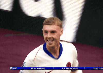 Soccer Player W. Fofana Smiling In Front Of Large Screen GIF