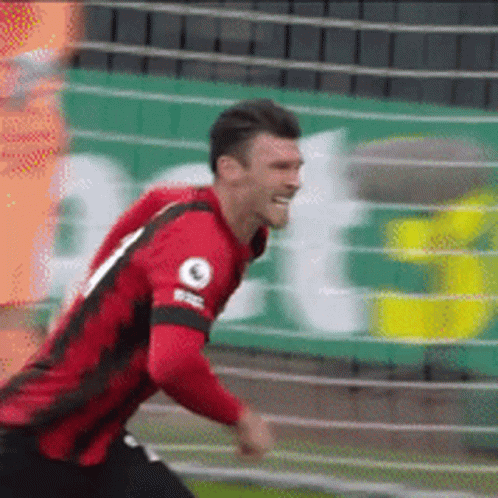 Soccer Player Wearing Red And Black Jersey Number 9 GIF
