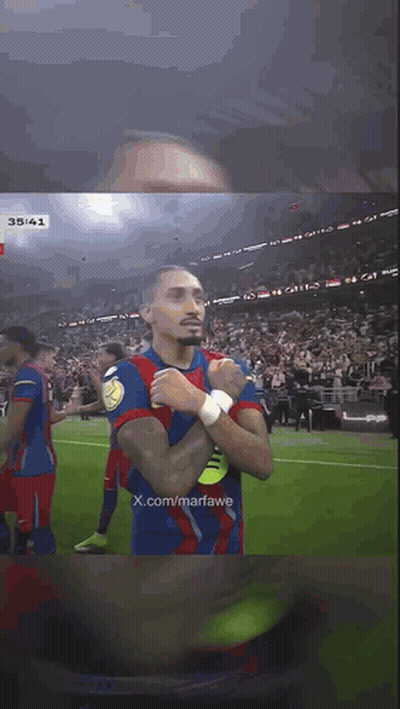 Soccer Player With Hands Folded In Front Of Crowd GIF