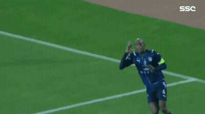 Soccer Players Are Celebrating A Goal On A Field With The Ssc Logo In The Corner GIF