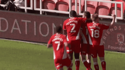 Soccer Players Celebrate Goal With Dation Sign GIF