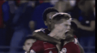 Soccer Players Celebrating Goal In Red GIF
