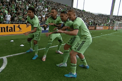 Soccer Players Celebrating Goal With Continental Sign GIF