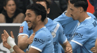 Soccer Players Celebrating Goal With RCM Jersey GIF