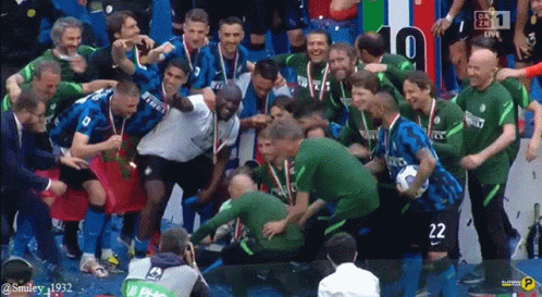 Soccer Players Celebrating Victory With Number 22 GIF
