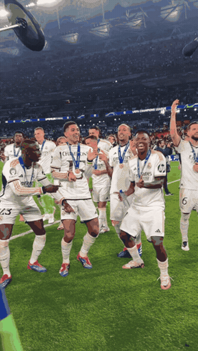 Soccer Players Celebrating With Medals GIF