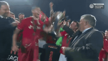 Soccer Players Celebrating With Trophy GIF