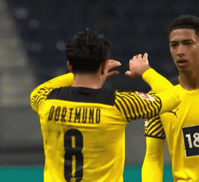 Soccer Players High Five During Game GIF